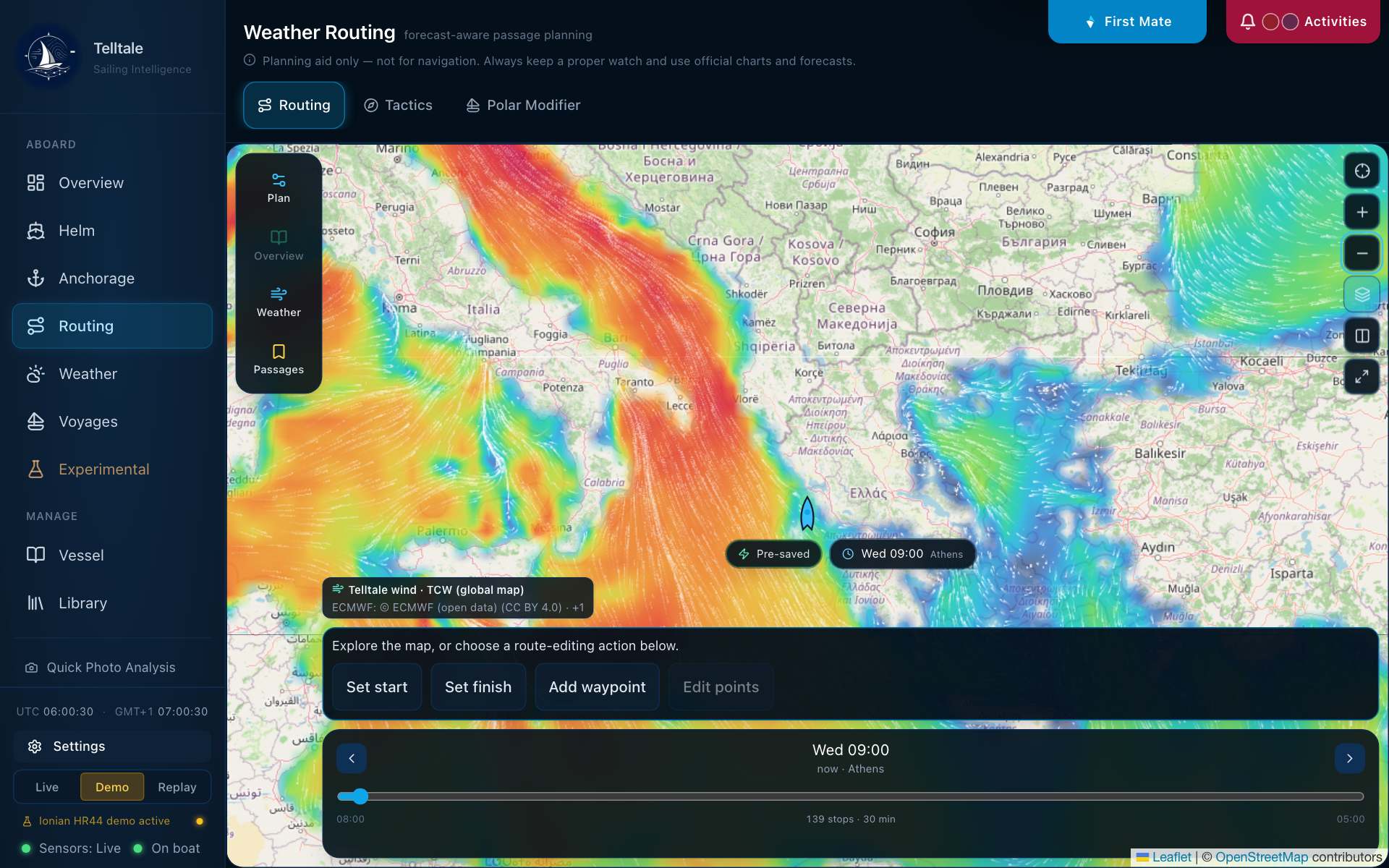 Routing map zoomed out over the central Mediterranean and the Balkans, with wind colour and particles over the sea and the land left clear, and a badge naming Telltale wind on the global map